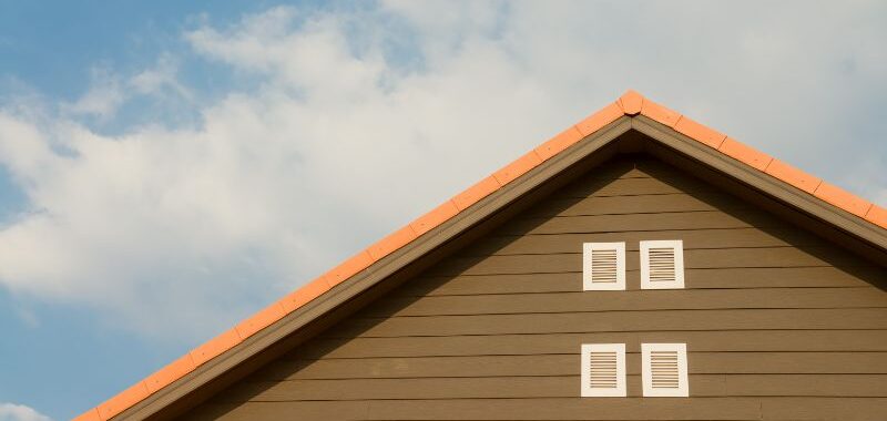 Orange and Brown Painted Roof Under Cloudy Sky